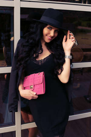 fashion summer outdoor photo of gorgeous woman with long dark hair in elegant outfit