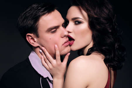 Valentine's day. fashion studio photo of lovely impassioned couple in elegant outfit