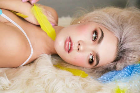 fashion studio photo of gorgeous sensual girl with blond hair in lingerie and accessoriesの写真素材