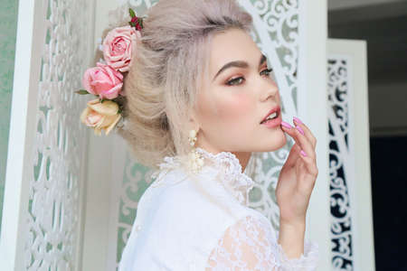 fashion studio photo of gorgeous sensual girl with blond hair in lingerie and accessoriesの写真素材