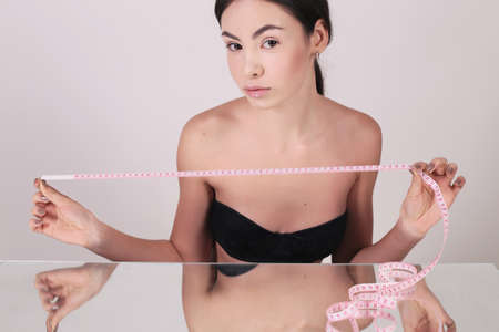 fashion interior photo of beautiful woman with dark hair and natural lookの写真素材