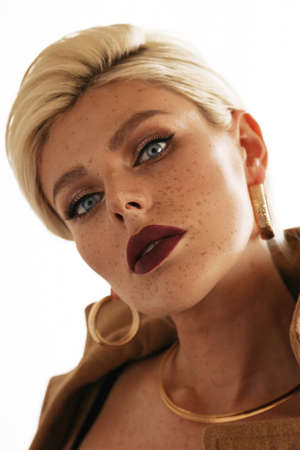 fashion photo of beautiful sexy woman with blond short hair with evening makeup and accessories, in...