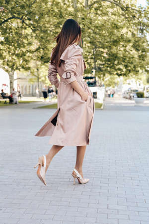 fashion outdoor photo of beautiful sensual woman with blond hair in elegant clothes posing near...