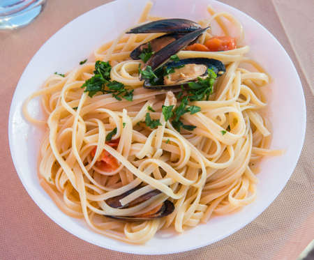 Spaghetti with mussels are tipical in the mediterranean cuisine, it is good for all seasons.の写真素材