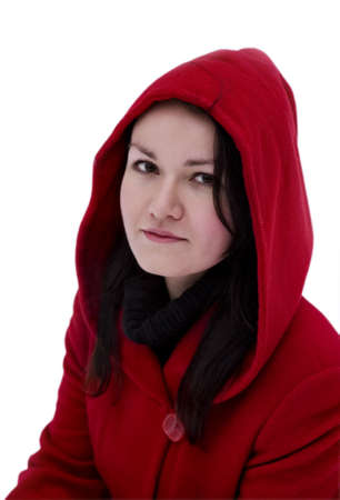 Pretty girl in the red coat on a white backgroundの写真素材