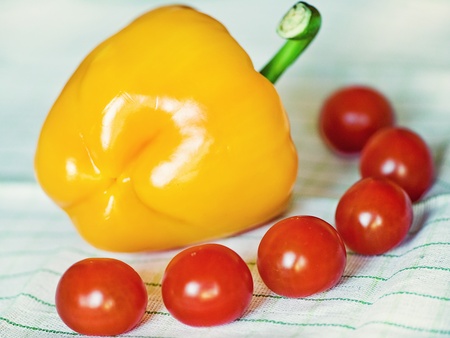 Yellow bulgarian pepper and cherry tomatoesの写真素材