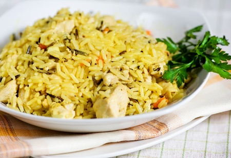 Pilau with chicken on the white plate の写真素材