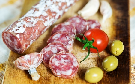 Sausage, tomato, garlic and olive の写真素材
