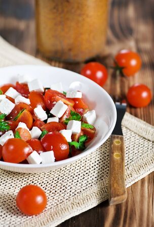 Salad with tomatoes, feta and parsleyの写真素材