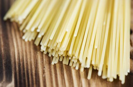 Italian spaghetti on the wooden backgroundの写真素材