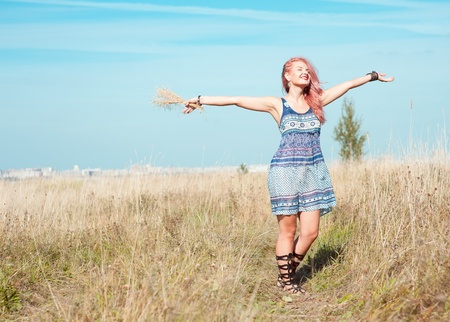 Happy beautiful smiling woman outdoorの写真素材