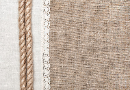 Burlap background, rope and linen cloth with laceの写真素材