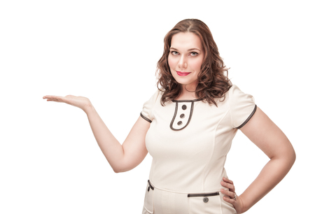 Beautiful plus size woman presenting on her empty palm isolatedの写真素材