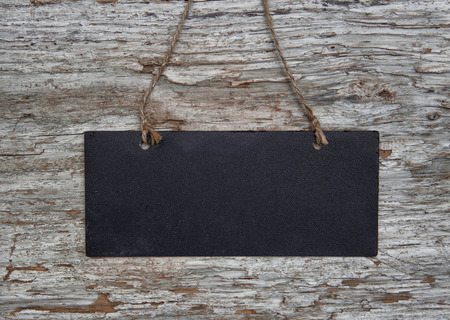 Chalkboard with rope on the old wood backgroundの写真素材