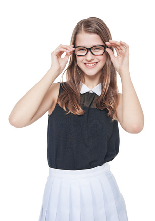 Portrait of young beautiful teenage girl in glasses on white backgroundの写真素材