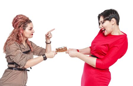 Beautiful plus size woman wants to eat cake isolated on white backgroundの写真素材