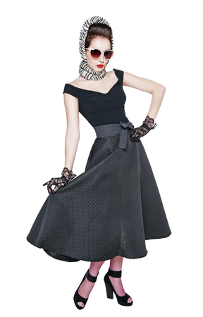 Young beautiful woman in retro pin up style posing isolated over whiteの写真素材