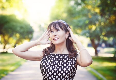 Portrait of beautiful woman in summer outdoor