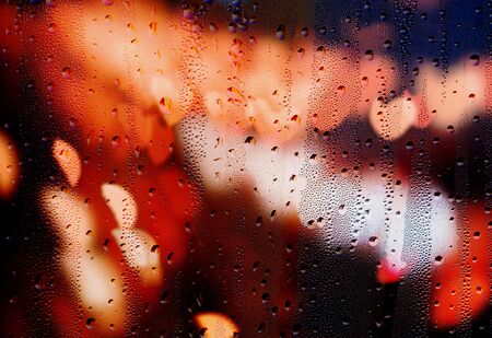 Drops of rain on glass with hearts abstract defocused blurred backgroundの写真素材