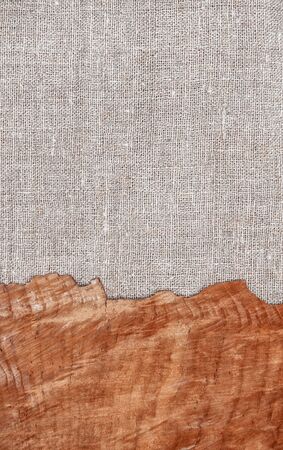 Grunge background with old wood on burlap clothの写真素材