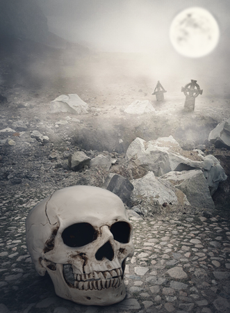 Halloween mystical landscape with big human skullの写真素材