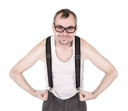 Funny nerd man showing his muscles isolated on whiteの写真素材