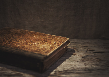 Vintage old book on the old wooden background