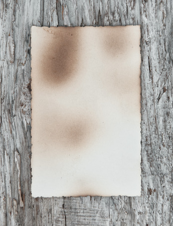 Vintage background with old paper on wood textureの写真素材