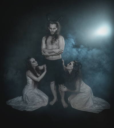 Two terrible ghost and demon with horns on dark backgroundの写真素材