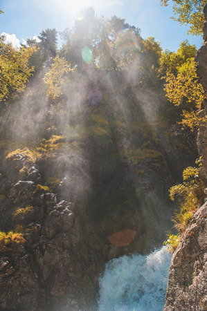 Tranquil scenery with mountain river and sunlight outdoorの写真素材