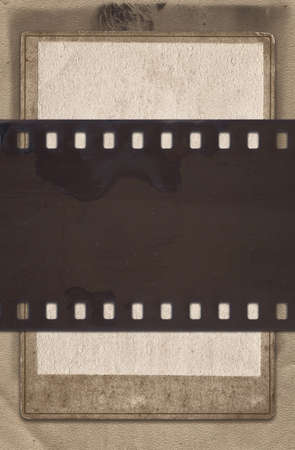 Vintage background with aged retro paper and old film stripの写真素材