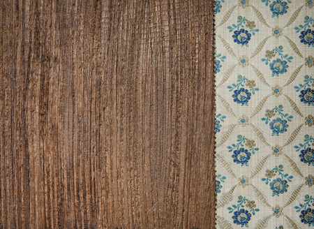 Floral green fabric on the old wood background