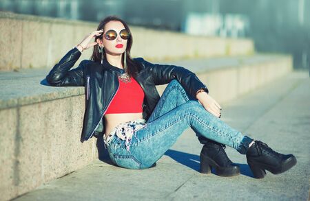 Beautiful fashion hipster trendy girl in sunglasses outdoor