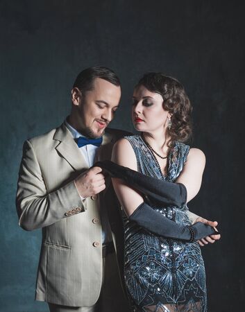 Portrait of beautiful elegant woman and handsome man in retro 20 â€“ 30 style