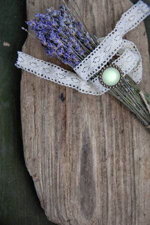 Dry lavender flowers bouquet on old rustic wooden backgroundの写真素材