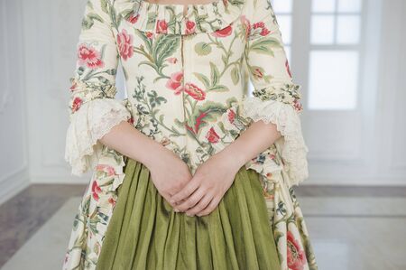 Hands of woman in beautiful vintage medieval dress