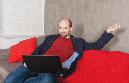 Business man with laptop working or study at home. Quarantine and pandemic conceptの写真素材