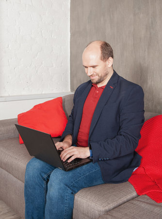 Business man with laptop working or study at home. Quarantine and pandemic conceptの写真素材