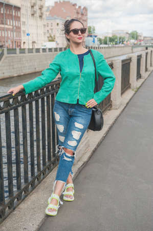 Beautiful stylish trendy young woman posing in the cityの写真素材