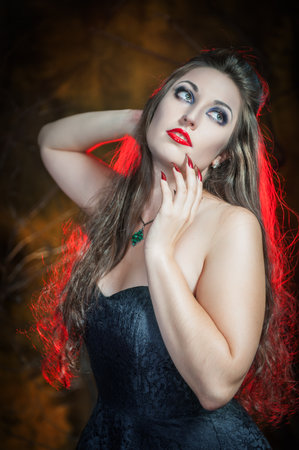 Beautiful sexy woman with long hair. halloween scene