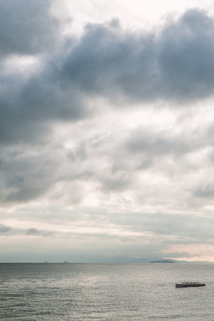 Beautiful landscape with dramatic sky, sea water and islandsの写真素材