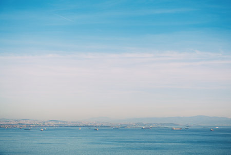 Beautiful evening view of the sea water, blue sky and buildings of Istanbul cityの写真素材