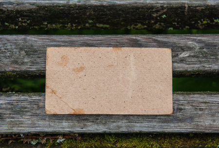 Vintage paper on the old weathered wooden fence backgroundの写真素材