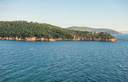 Beautiful sea landscape with green forest islands and sky