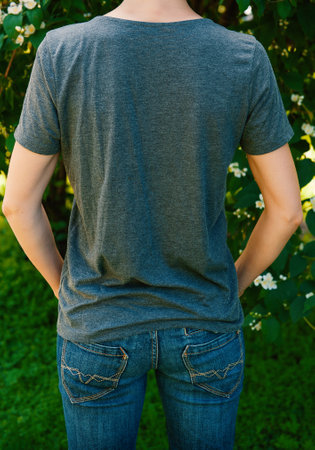 Woman wears gray t-shirt back view mockup ideal for fashion designの写真素材
