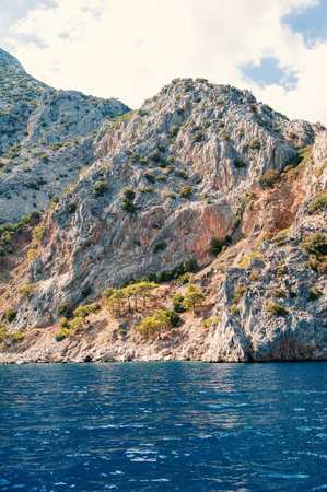 Breathtaking coastal landscape in Turkey with turquoise waters and pine-covered mountainsの写真素材