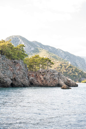 Breathtaking coastal landscape in Turkey with turquoise waters and pine-covered mountainsの写真素材