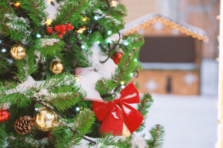 Festive pine tree decoration captured with a cozy, bokeh-filled background. Christmas backgroundの写真素材