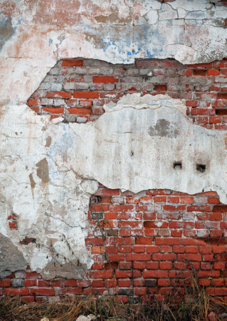 Old distressed vintage wall bricks background with cracked paintの写真素材