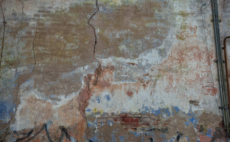 Cracked vintage wall with textured surface and rustic charmの写真素材